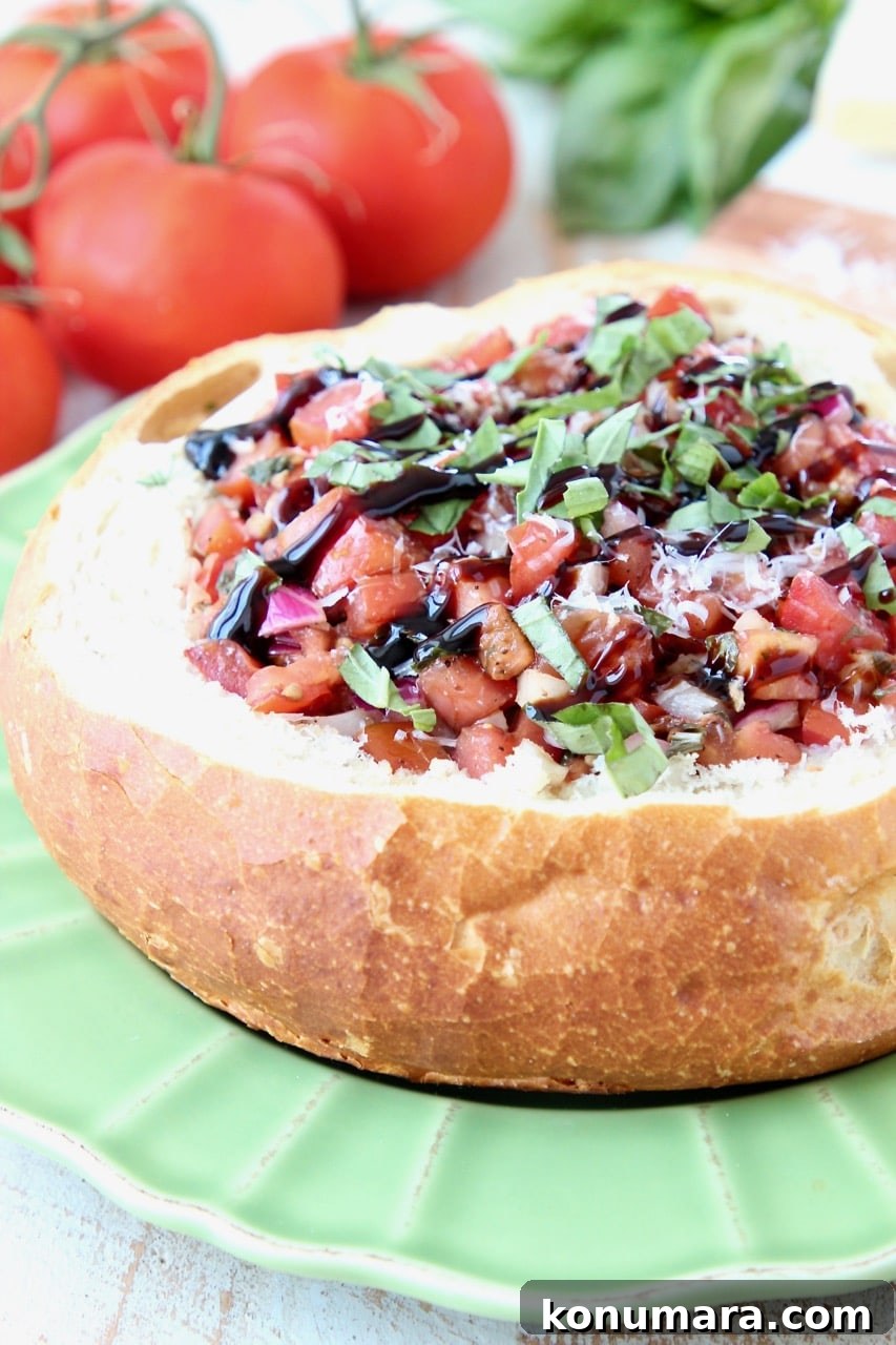 Baked Brie in a Bread Bowl with Tomato Basil Bruschetta and Balsamic Reduction