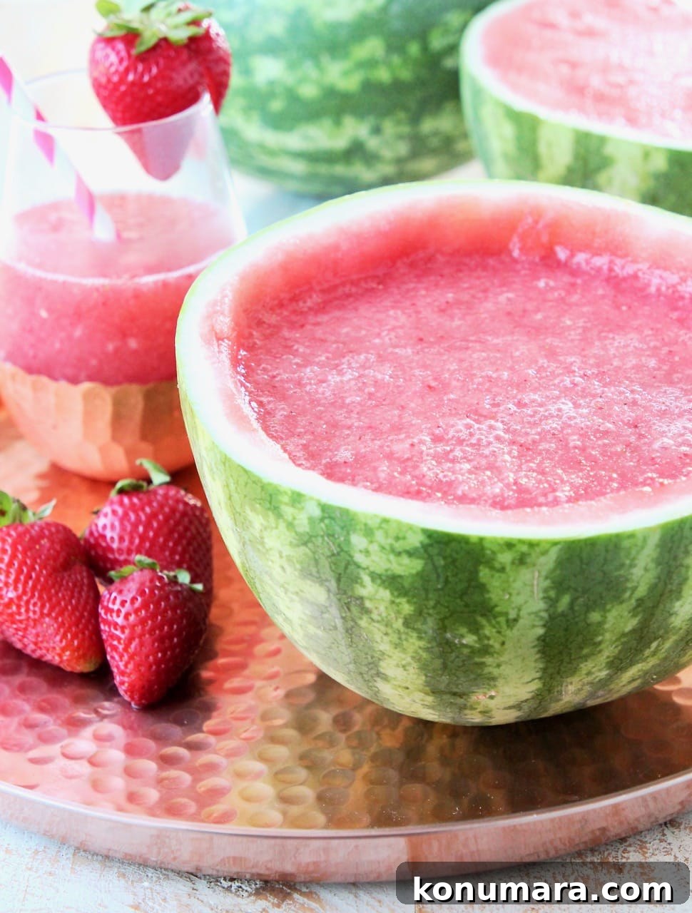 Strawberry Watermelon Wine Slushies Recipe 4 Blended Strawberry Watermelon Wine Slushies in a hollowed watermelon