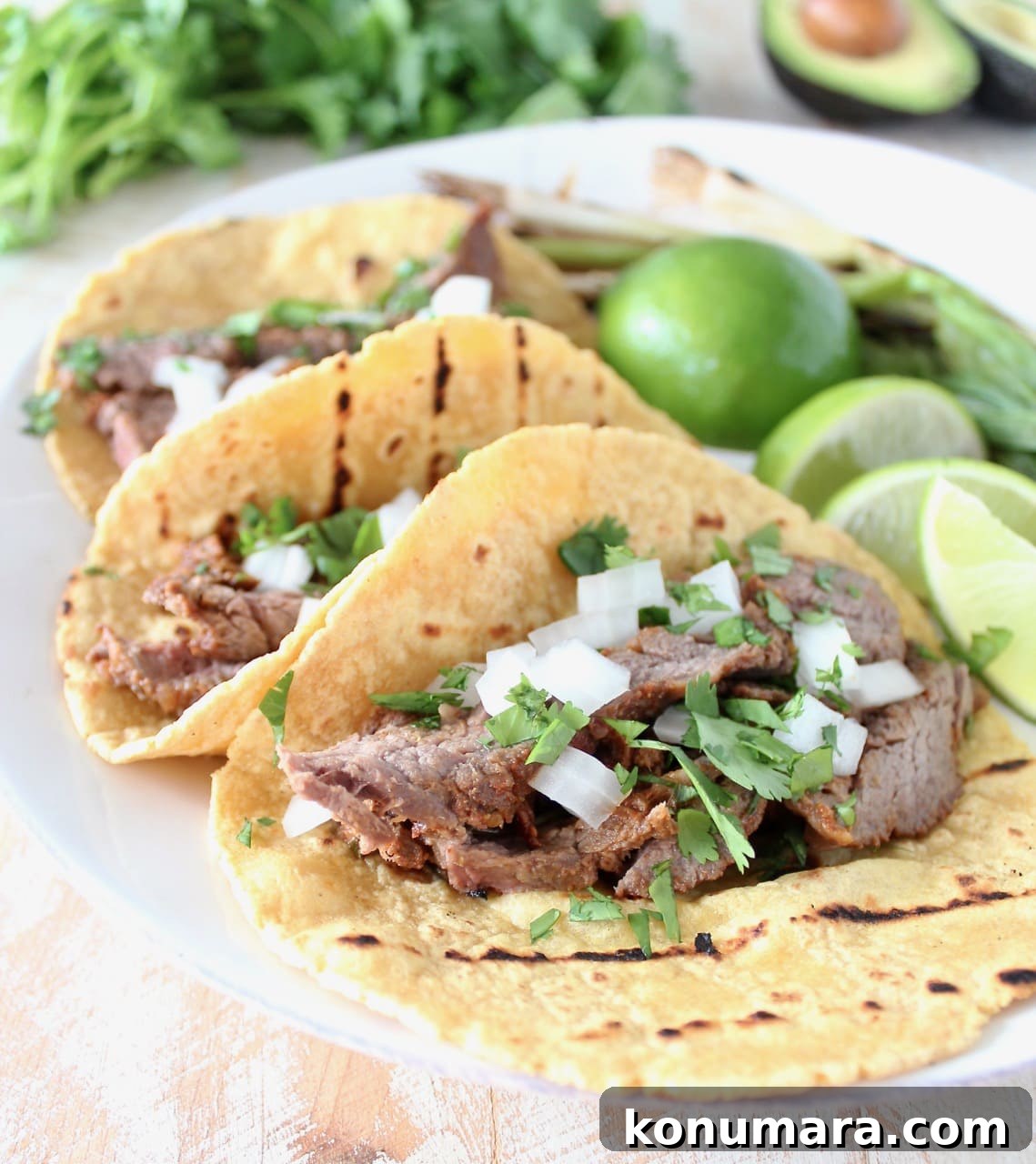 Carne Asada Tacos with Fresh Limes, Onions and Cilantro