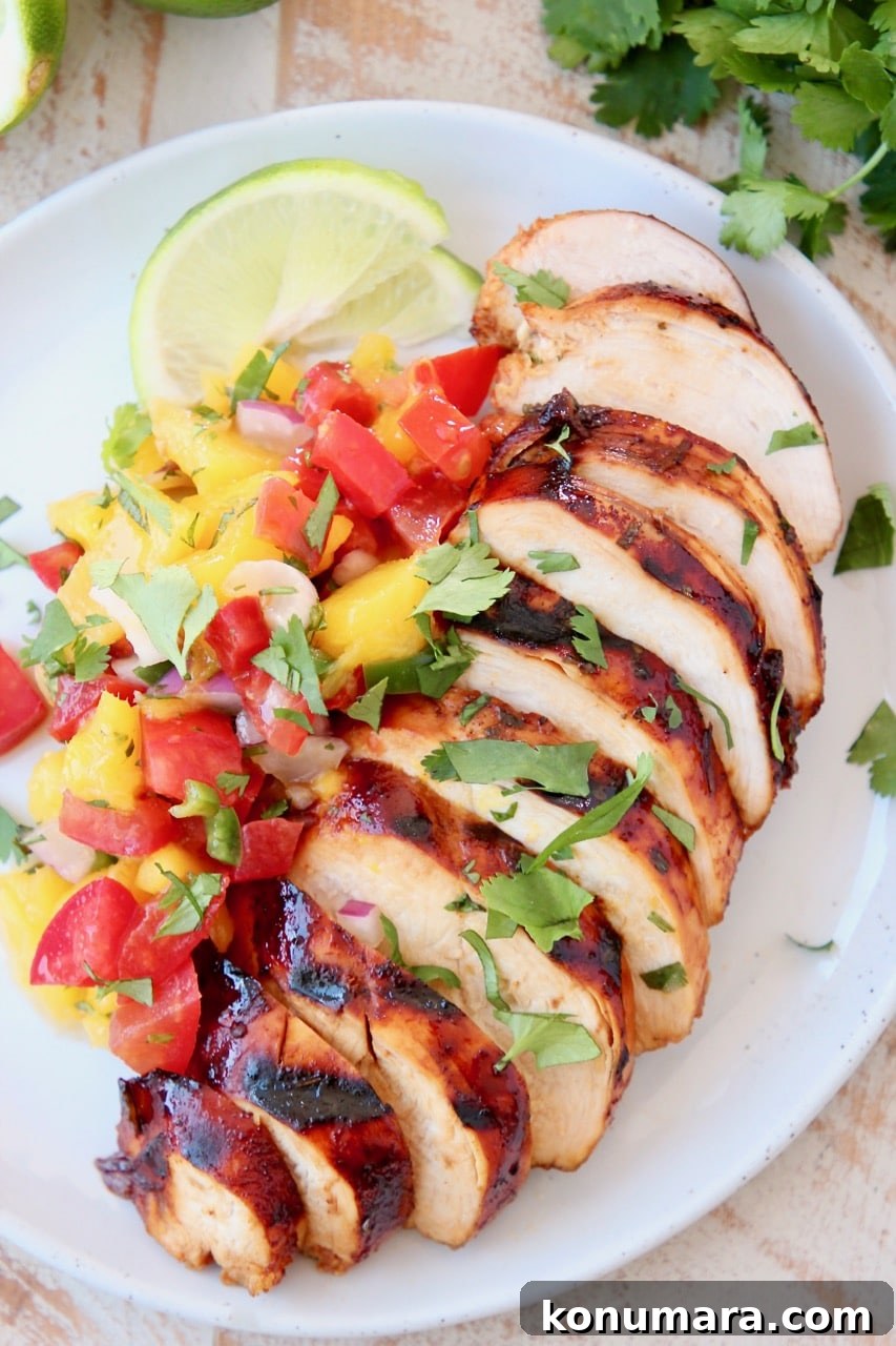 Grilled Chicken topped with Mango Salsa and Fresh Cilantro