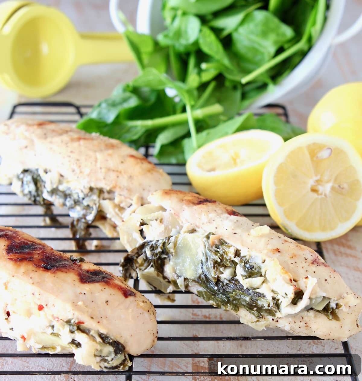 Stuffed Spinach Artichoke Chicken with Lemons and Fresh Spinach