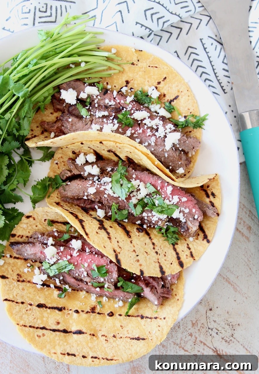 Cajun Steak Tacos Recipe 3 Cajun Steak Tacos in Grilled Corn Tortillas with Fresh Cilantro and Cotija Cheese
