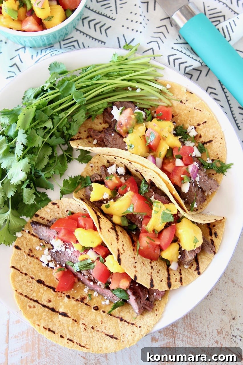 Cajun Steak Tacos Recipe 5 Cajun Steak Tacos on Grilled Corn Tortillas with Fresh Mango Salsa and Cilantro