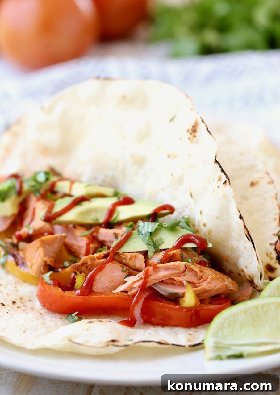 Salmon Fajitas in Flour Tortilla with Sliced Avocado
