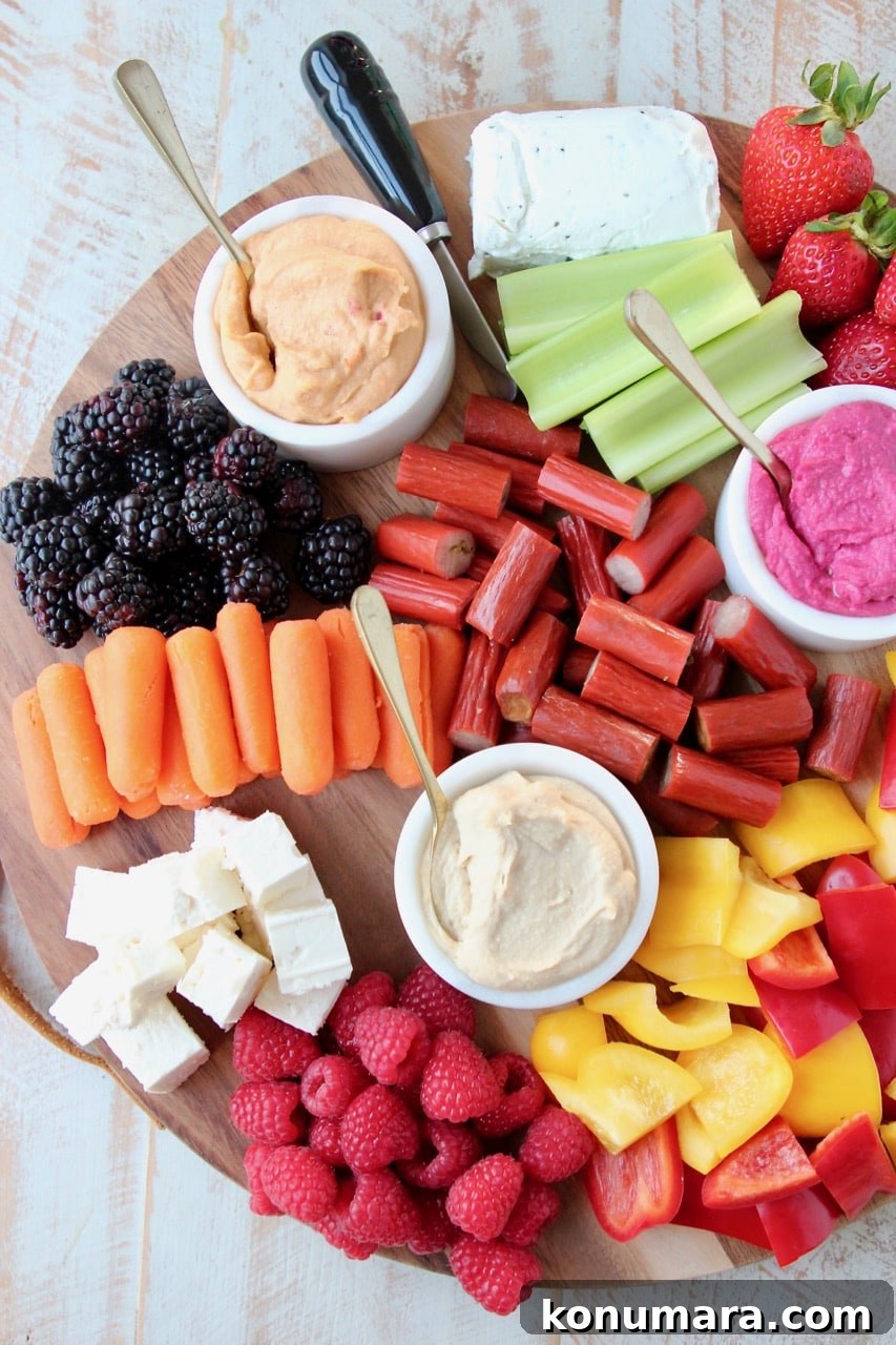 Low-Calorie Charcuterie Board Recipes That Impress 2 Low Calorie Charcuterie Board with Carrots, Celery, Bell Peppers, Hummus, Berries and Chicken Snack Sticks