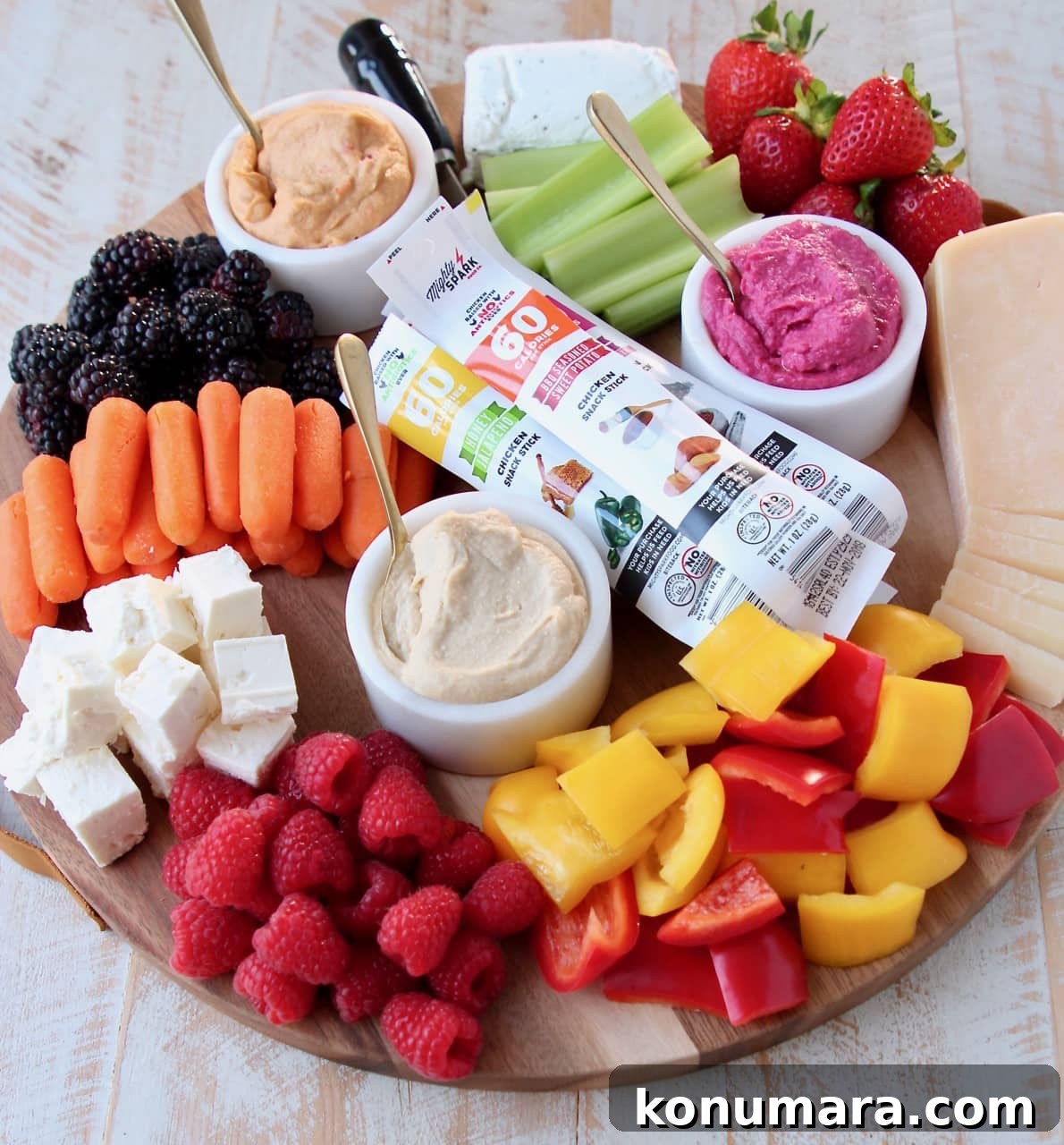 Low-Calorie Charcuterie Board Recipes That Impress 3 Low Calorie Charcuterie Board with Cheeses, Veggies, Berries, Hummus and Chicken Snack Sticks