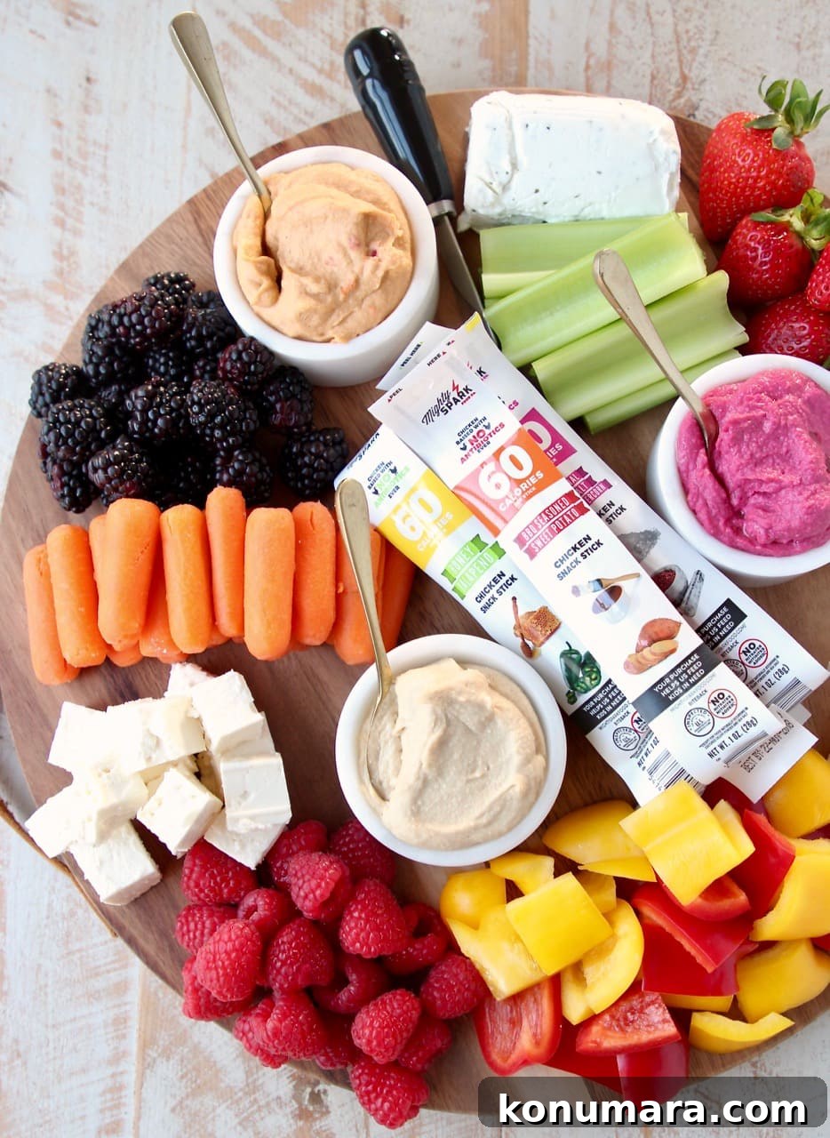 Low-Calorie Charcuterie Board Recipes That Impress 5 Low Calorie Gluten Free Charcuterie Board with Berries, Celery, Carrots, Bell Peppers, Hummus and Cheese