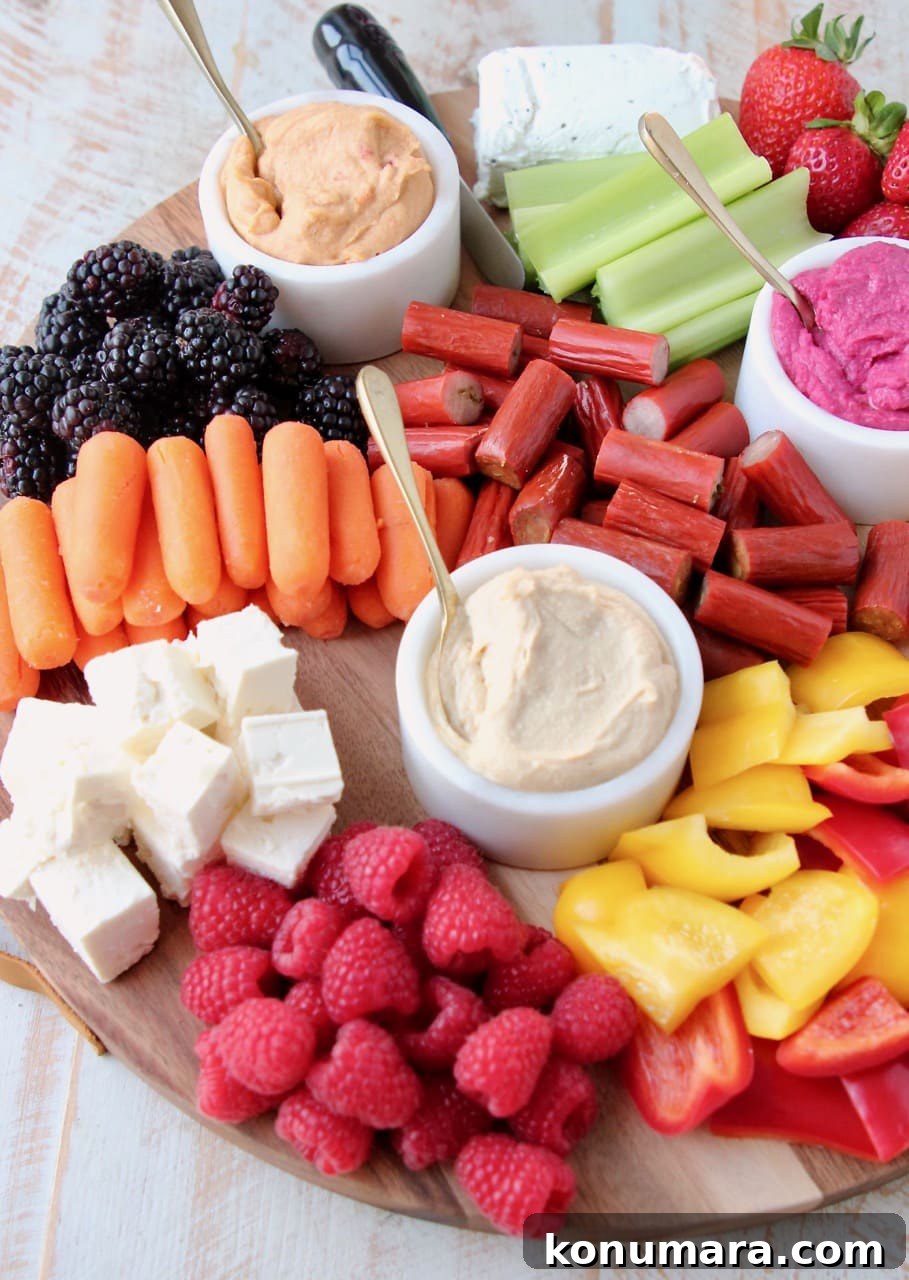 Low-Calorie Charcuterie Board Recipes That Impress 6 Low Calorie Charcuterie Board with Hummus, Veggies, Fruits, Cheeses and Chicken Snack Sticks