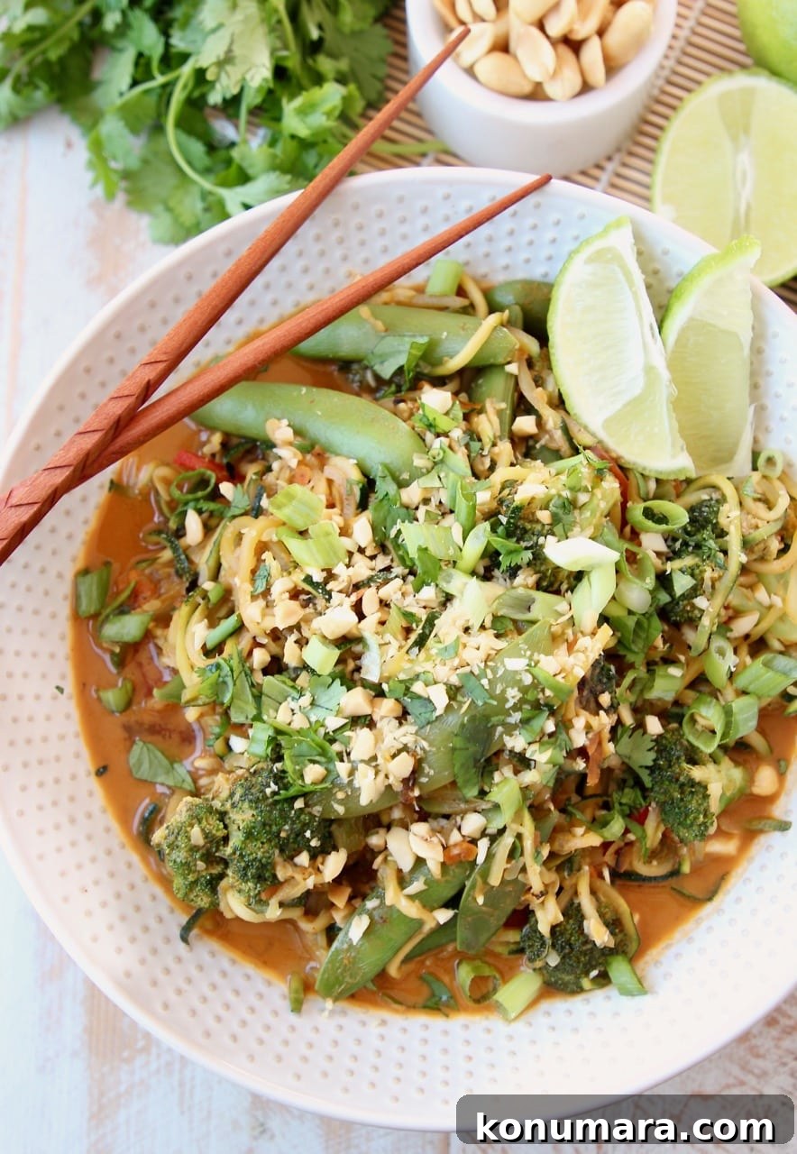 Vegan Zucchini Noodle Pad Thai with Peanut Sauce 4 Vegan Pad Thai Recipe with Fresh Scallions, Limes, Broccoli and Cilantro in bowl with chopsticks