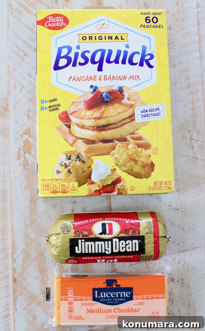 ingredients for bisquick sausage balls on white wood board