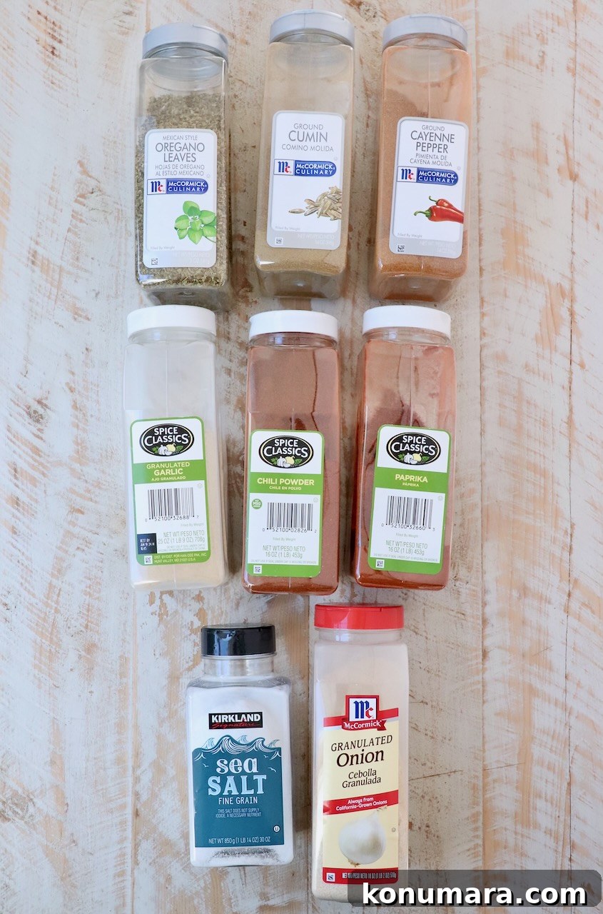 Homemade Taco Seasoning Mix Recipe 3 taco seasoning ingredients on white wood board