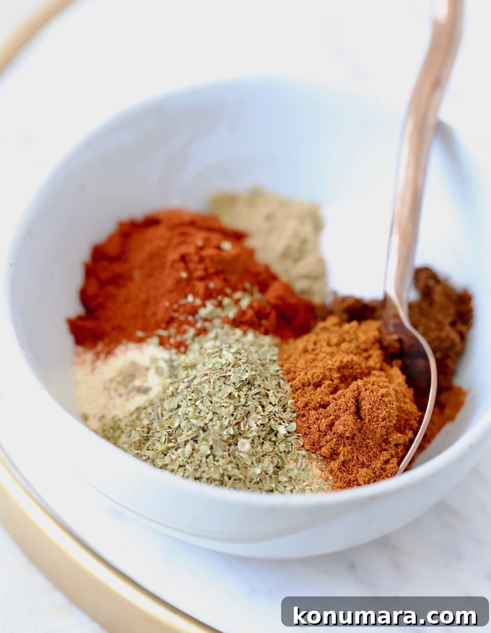 Homemade Taco Seasoning Mix Recipe 5 Homemade taco seasoning with 8 different spices in bowl with spoon