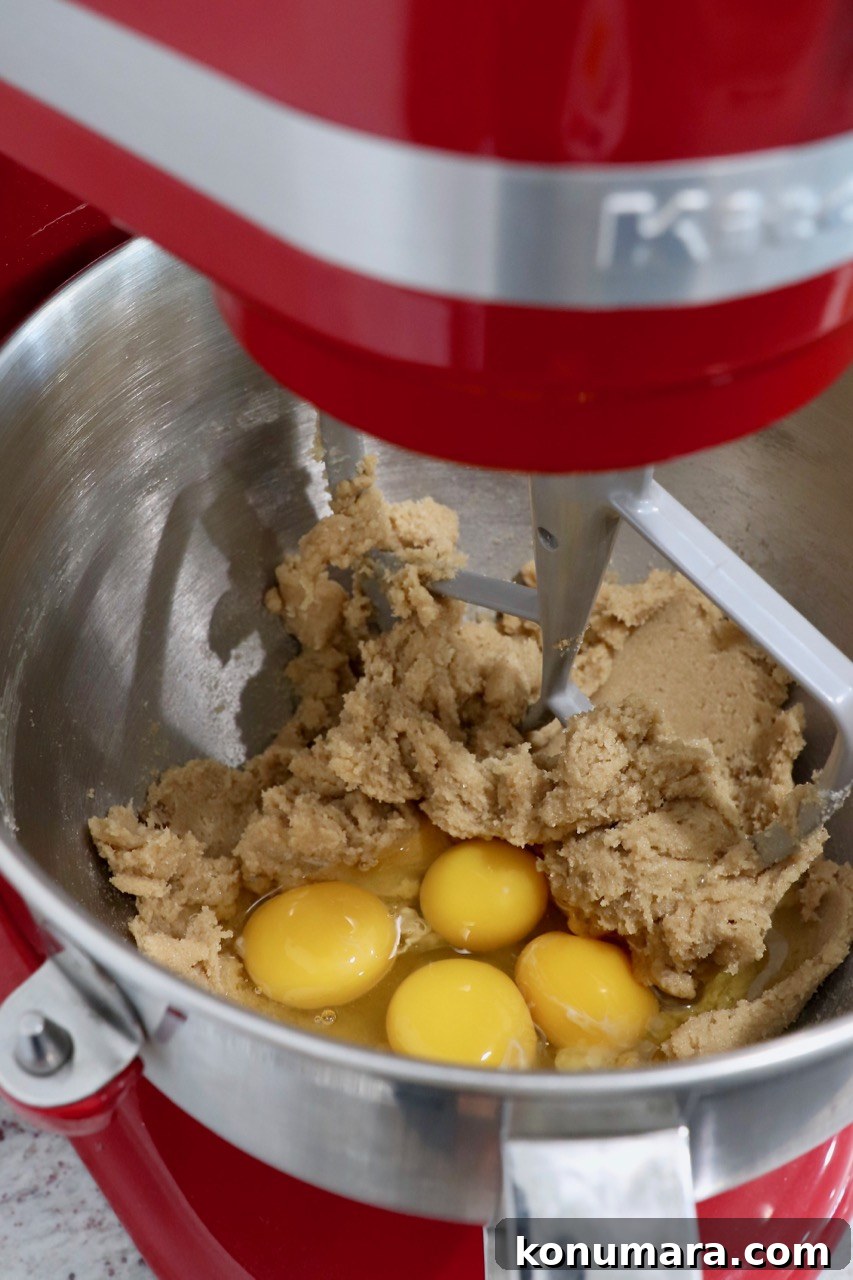 Moist Pumpkin Cupcakes with Tangy Cream Cheese Frosting 5 cupcake dough in stand mixer with raw eggs