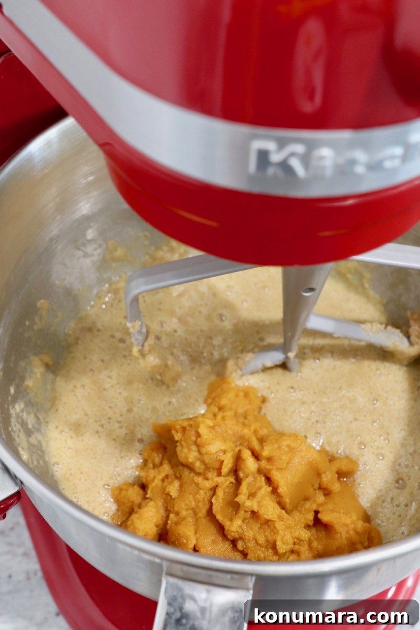 Moist Pumpkin Cupcakes with Tangy Cream Cheese Frosting 6 cupcake batter in stand mixer with pumpkin puree