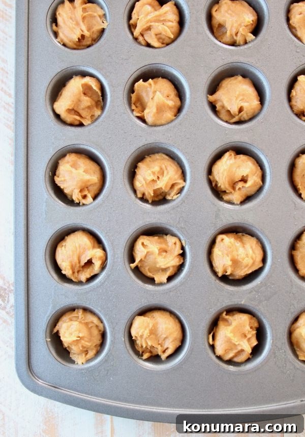 Salted Caramel Pumpkin Cookie Cups 3 Pumpkin cookie dough in mini muffin tin