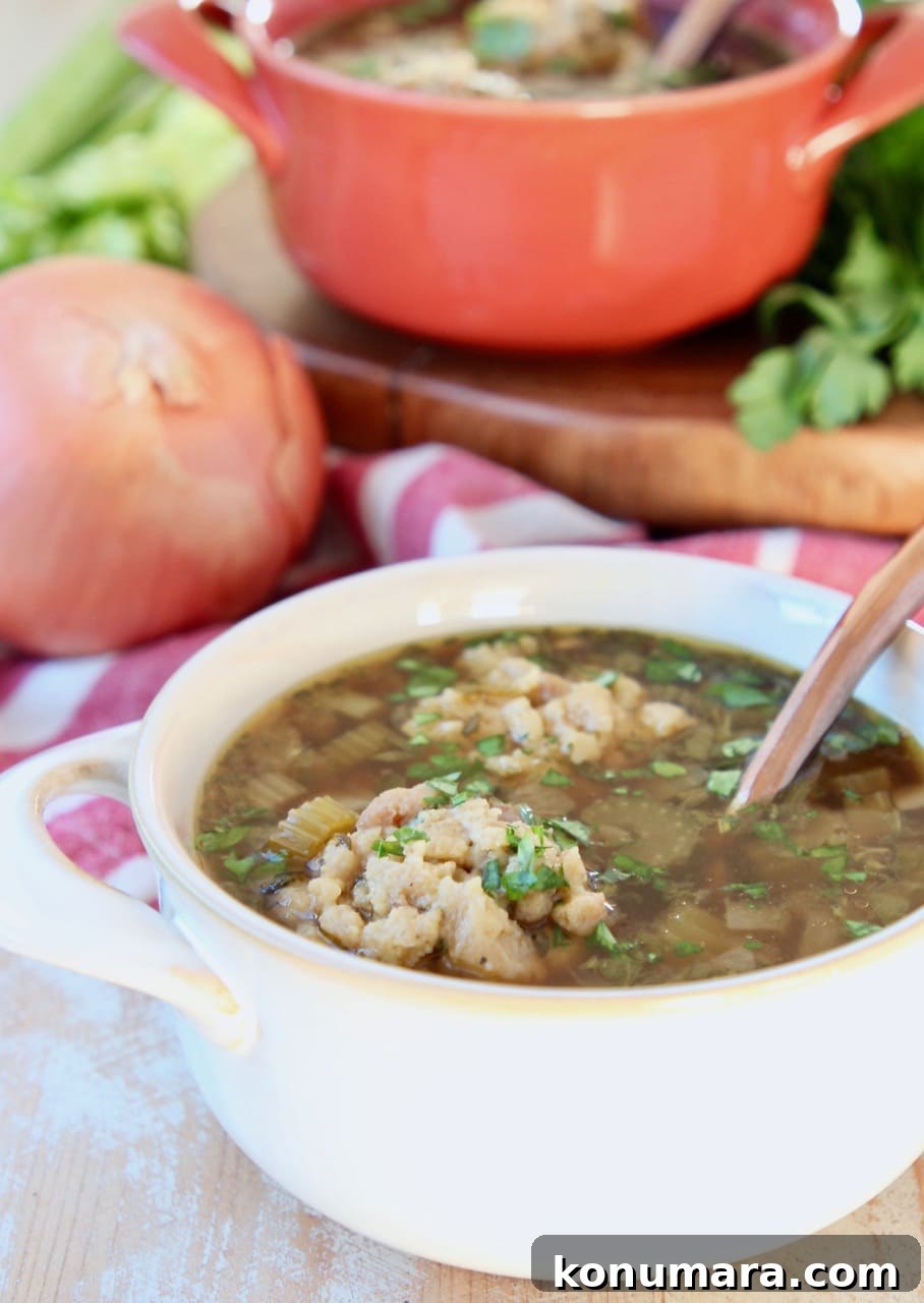 Instant Pot Turkey Soup with Savory Stuffing Dumplings 2 Instant Pot Turkey Soup with stuffing dumplings in white and orange crocks with yellow onion, celery, wood cutting board and red and white striped towel in background