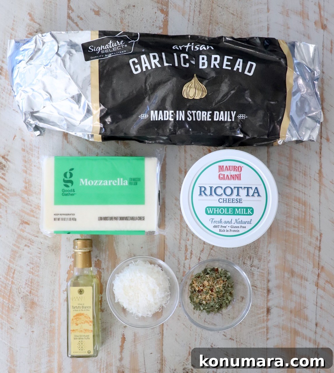 Cheesy Garlic Bread Nachos Recipe 3 Packaged garlic bread on a wooden surface, surrounded by mozzarella, ricotta, olive oil, grated cheese, and herbs