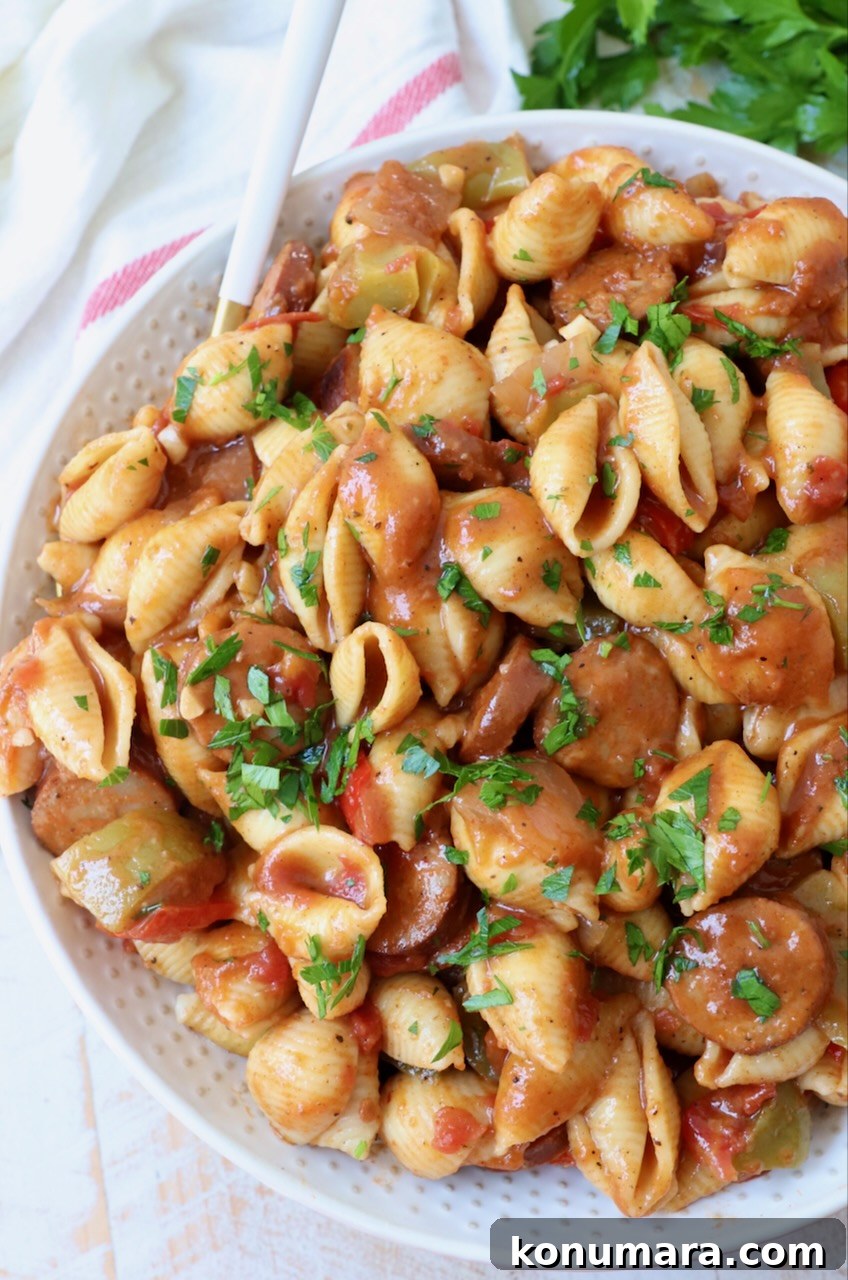 cajun pasta with sauce in a large bowl with a fork