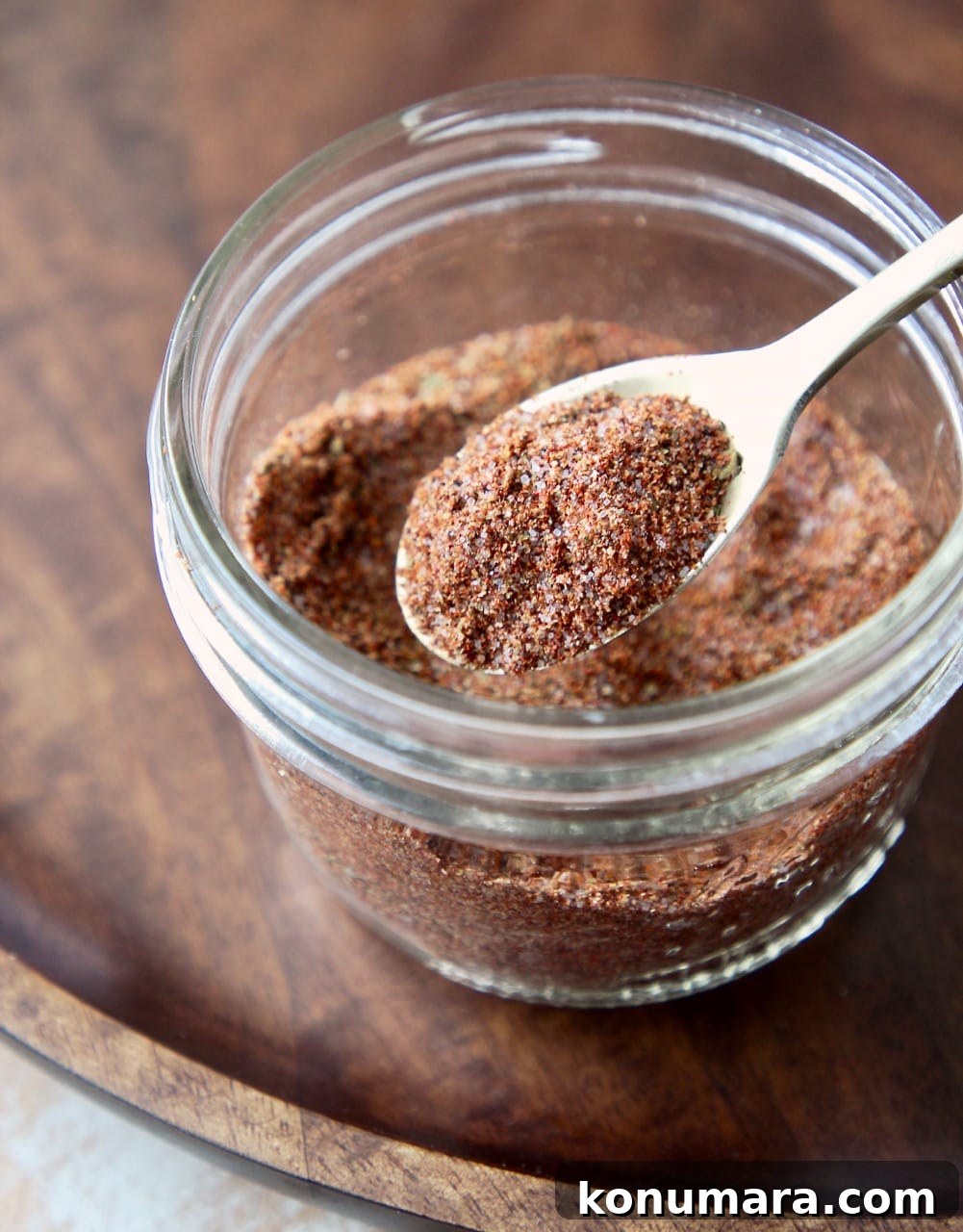 Homemade Fajita Seasoning Mix Recipe 4 Fajita seasoning blend in a mason jar with a gold spoon full of the seasoning