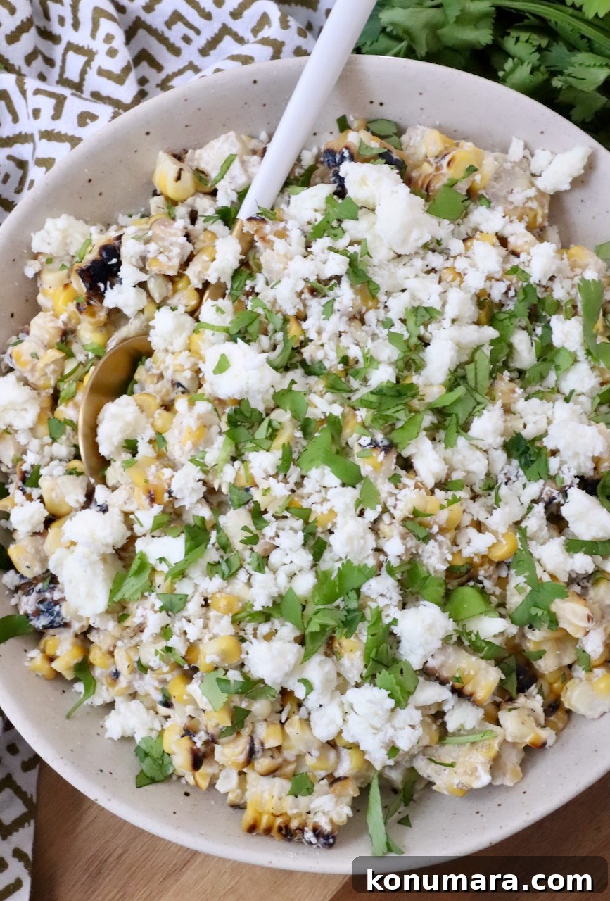 prepared elote in a bowl with a spoon