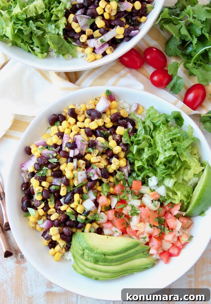 Loaded Vegan Burrito Bowl with Black Beans and Avocado 2 Burrito bowl filled with corn and black bean relish, pico de gallo, avocado and shredded lettuce