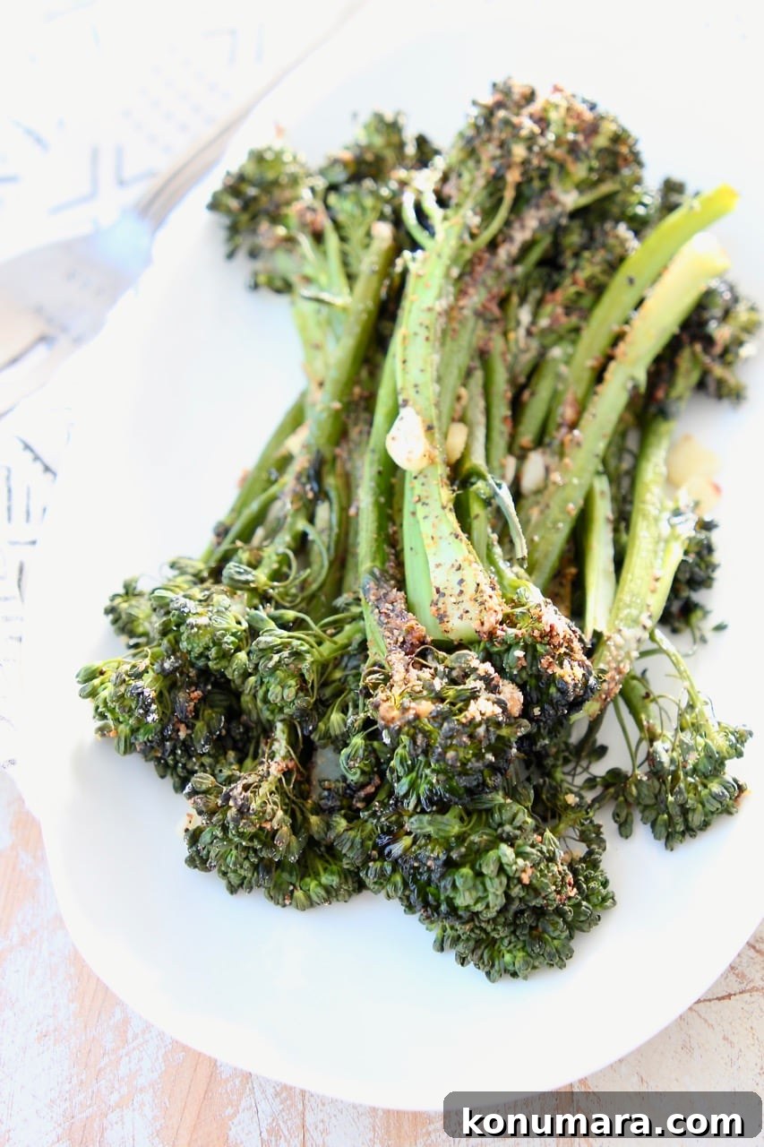 Roasted broccolini on white plate