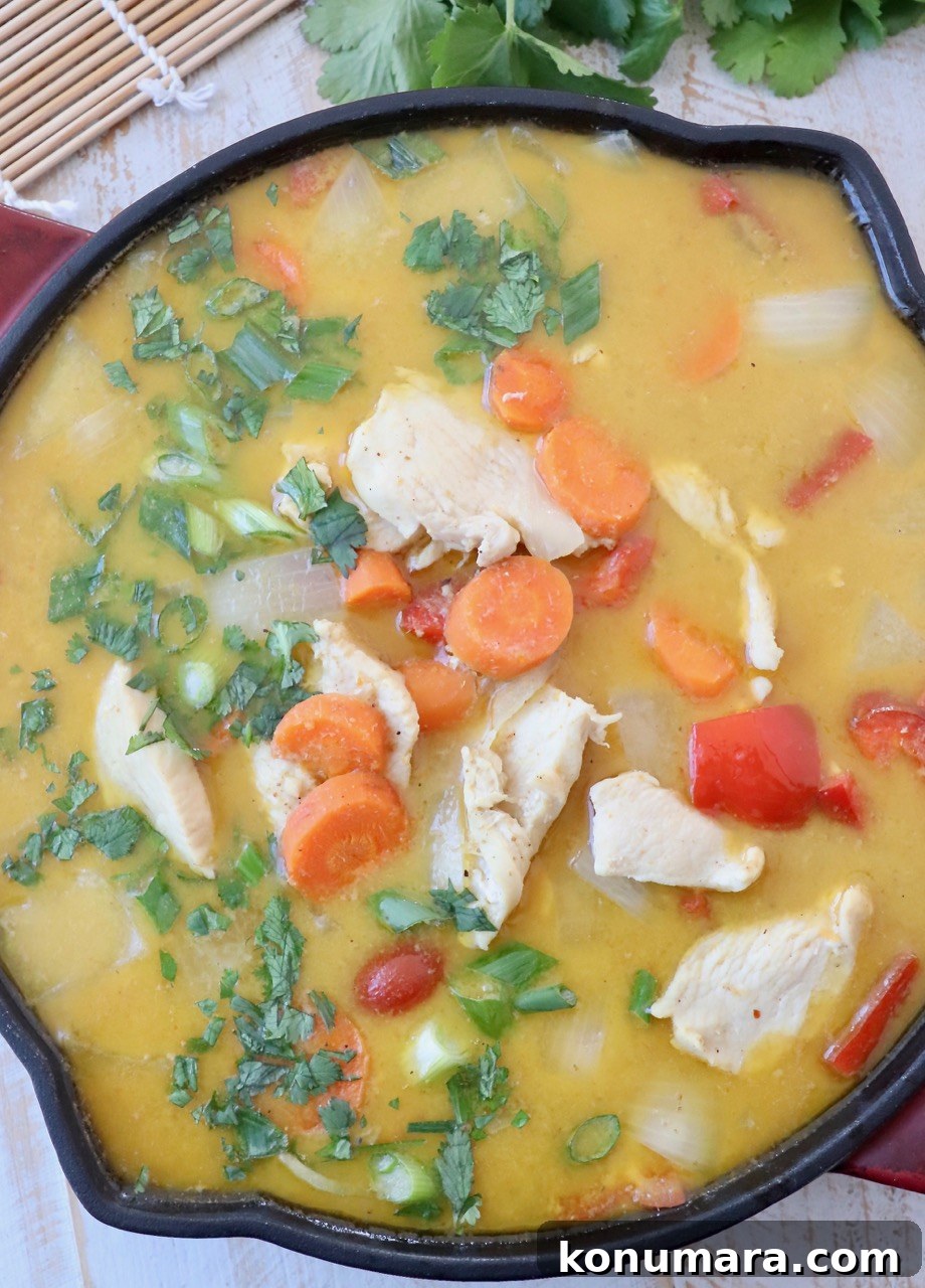 Authentic Thai Yellow Curry Recipe with Coconut Milk 2 chicken and vegetables in yellow curry sauce in skillet