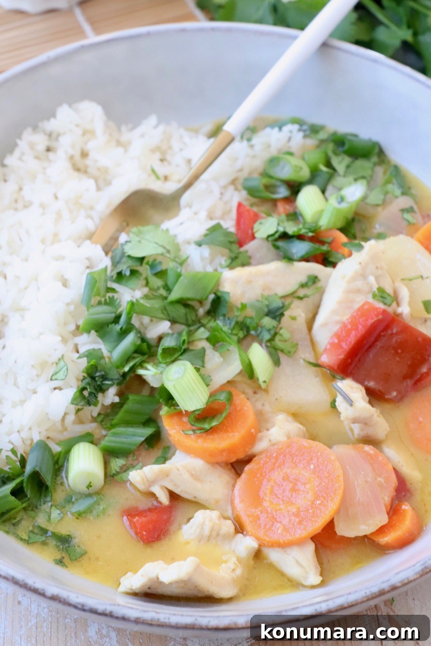 Authentic Thai Yellow Curry Recipe with Coconut Milk 8 yellow chicken curry in bowl with vegetables and rice