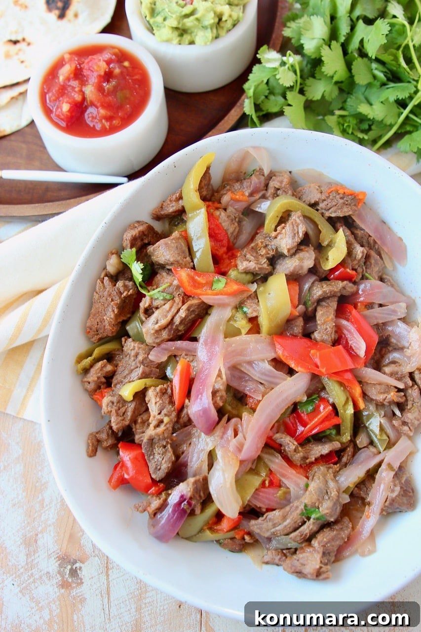 Steak fajitas in white bowl