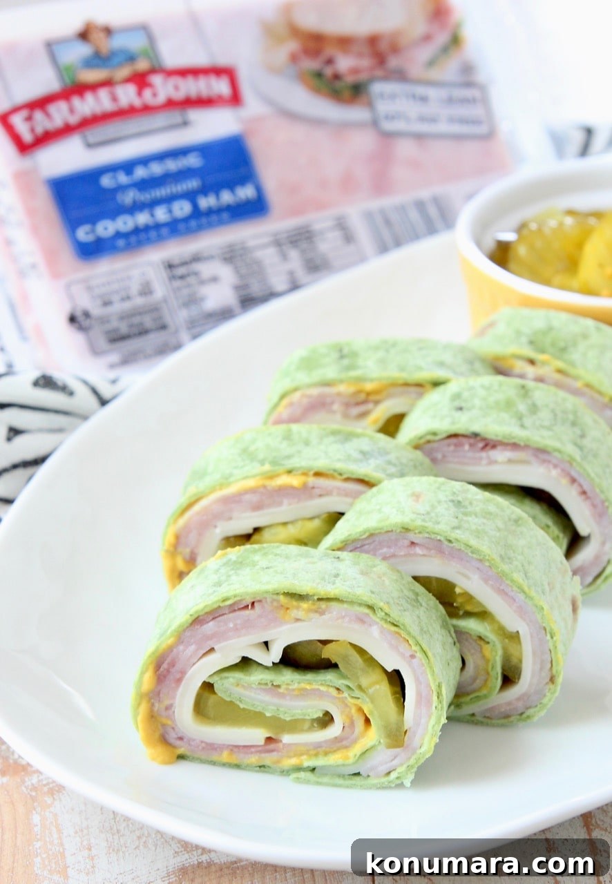 Tortilla wrapped pinwheel sandwiches on white plate