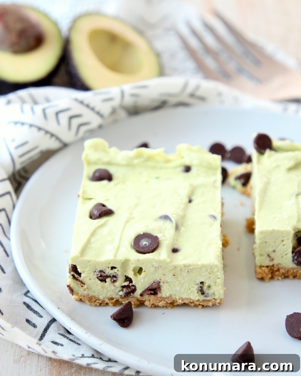 Avocado no bake cheesecake bars with chocolate chips on a plate