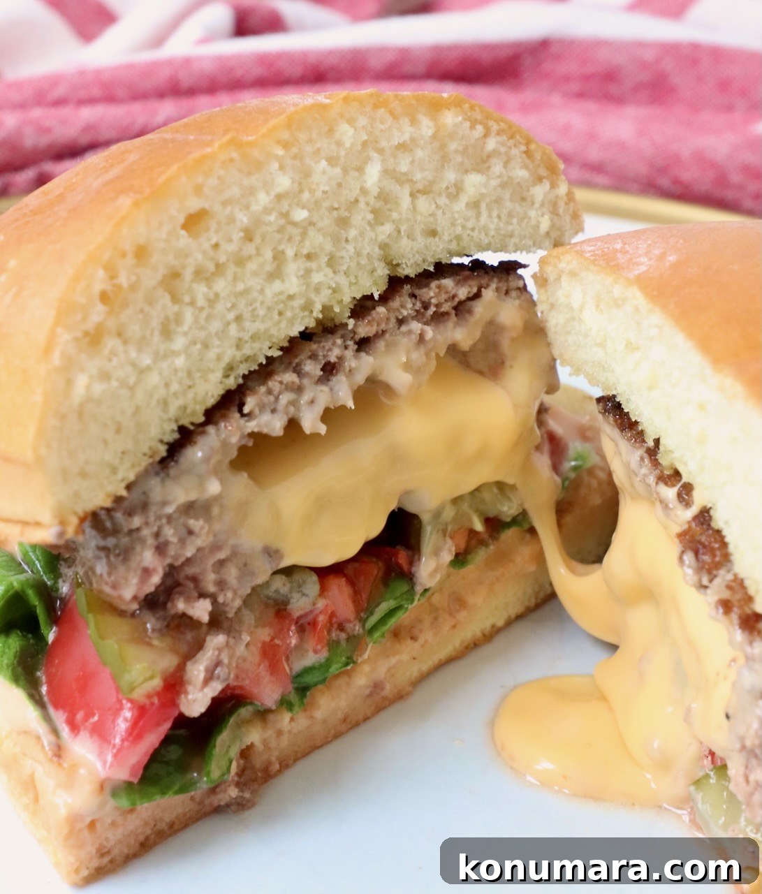 stuffed burger with cheese in the middle on plate