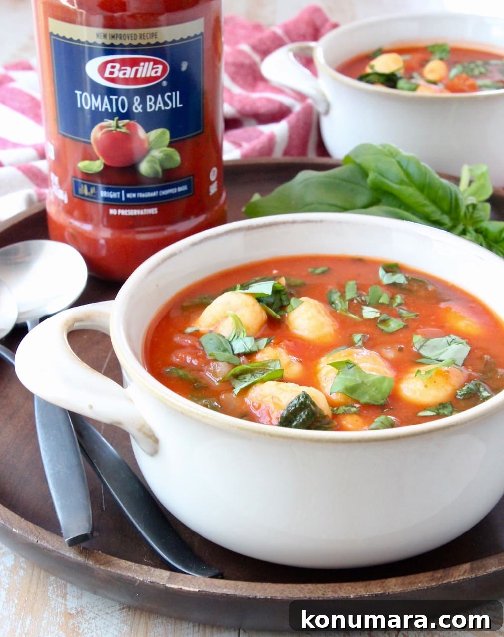 Creamy Tomato Basil Gnocchi Soup Recipe 5 Gnocchi soup in white crock on wood serving tray with spoons
