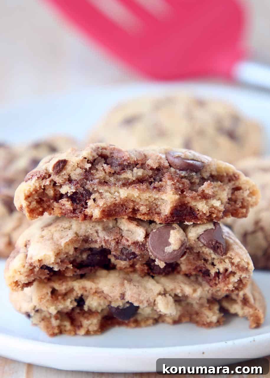 Chewy Nutella Chocolate Chip Cookies 2 Nutella chocolate chip cookies broken in half and stacked on top of each other