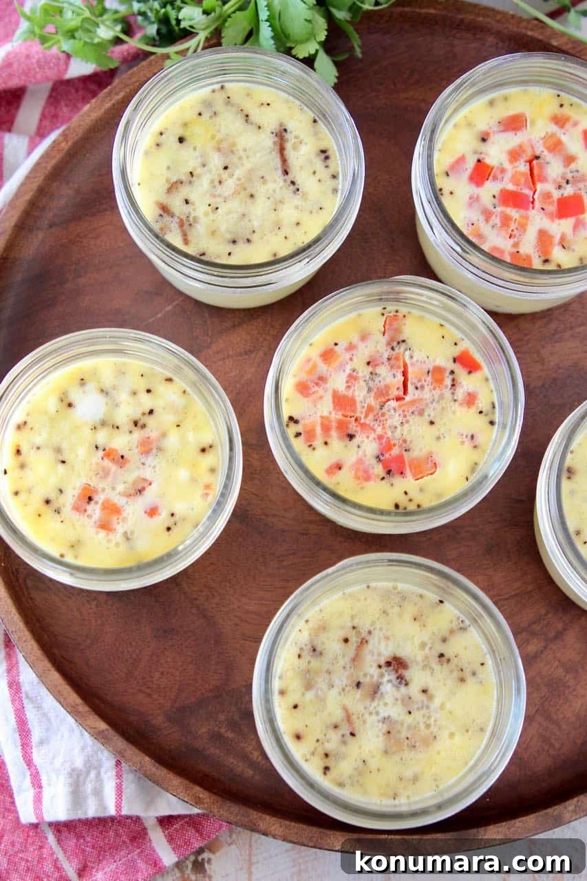 Sous vide egg bites in mason jars on wood cutting board