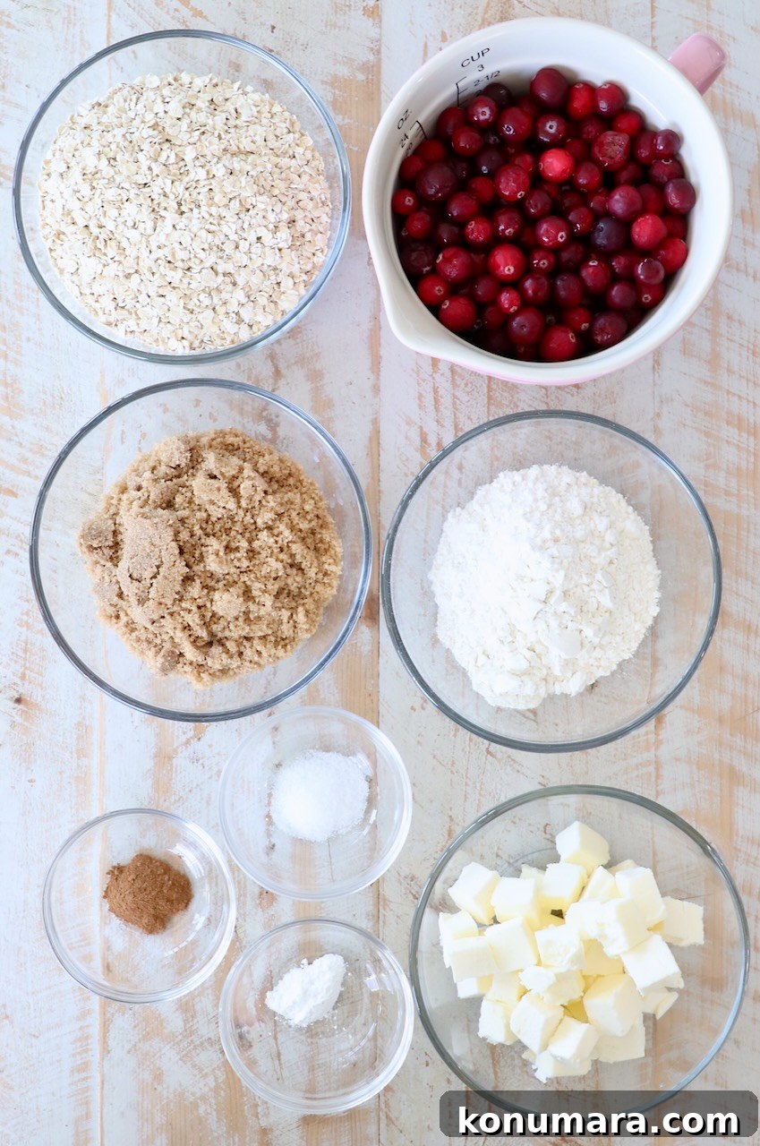 Homemade Oatmeal Cranberry Bars Recipe 3 ingredients for oatmeal cranberry bars on white wood board