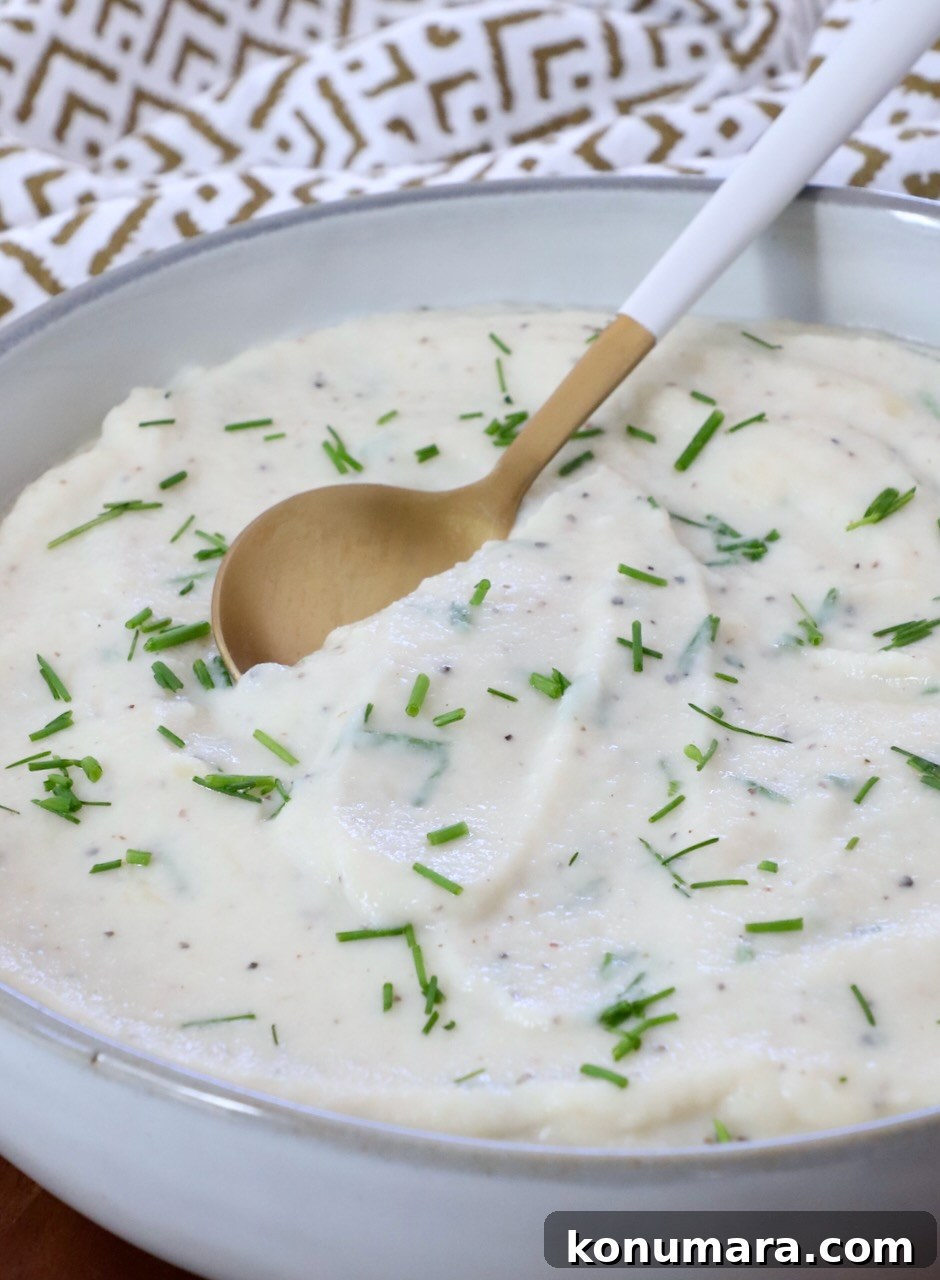 mashed cauliflower in a bowl with a spoon