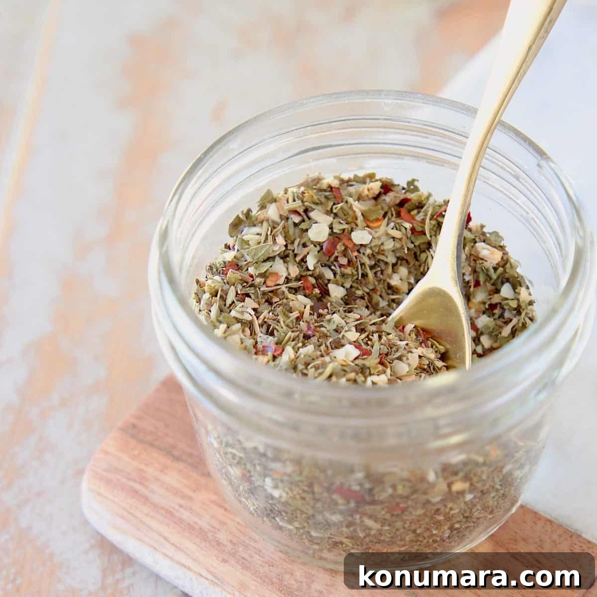 19 New Recipes from 2019 Worth Revisiting 13 Mason jar of homemade Italian seasoning on a wood and marble cutting board with a small gold spoon in the jar