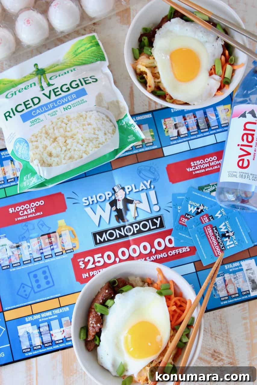 Korean BBQ Cauliflower Rice Bowl with Gochujang Glaze 2 Korean BBQ rice bowls topped with fried egg, sitting on Albertsons monopoly board
