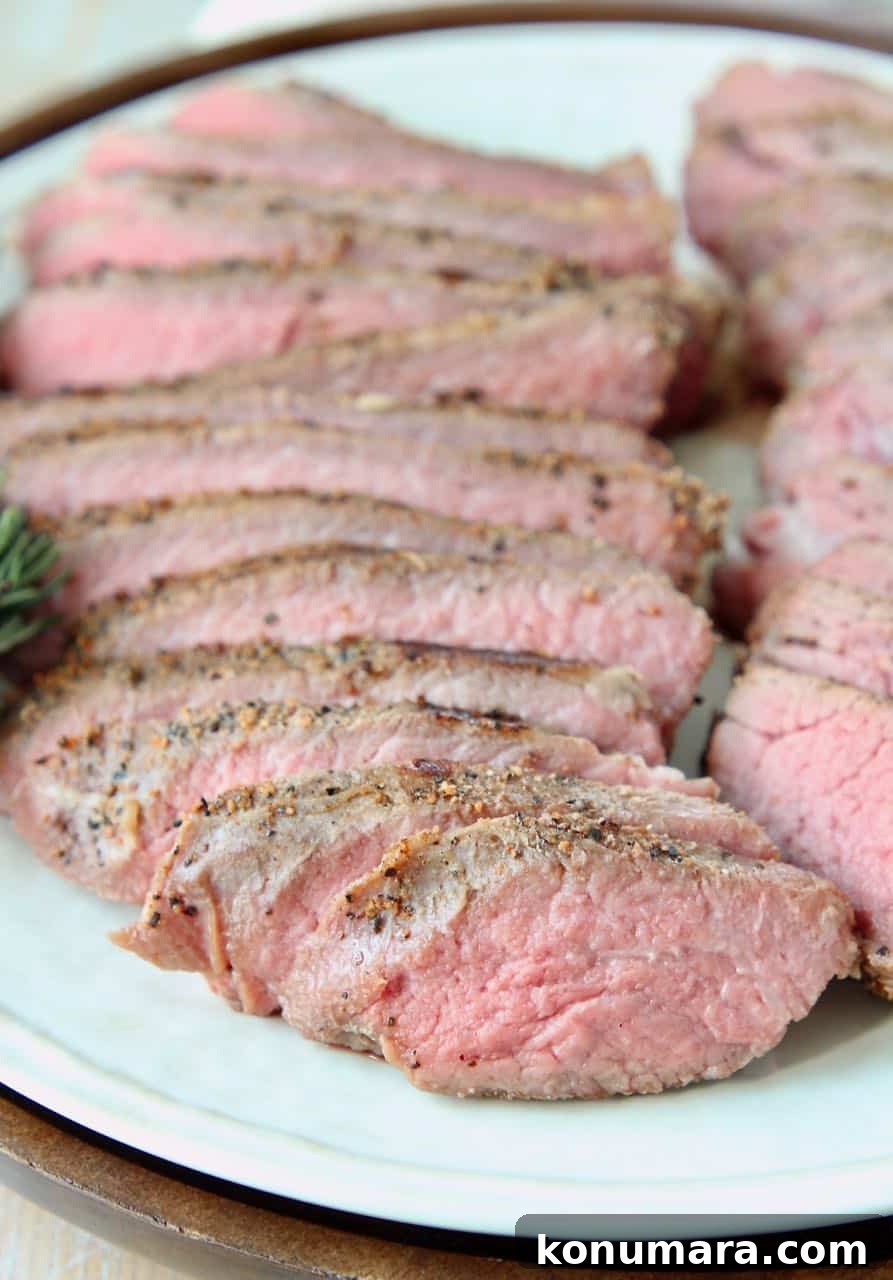 Sliced tri tip steak on plate