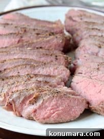 Sliced sous vide tri tip on white plate