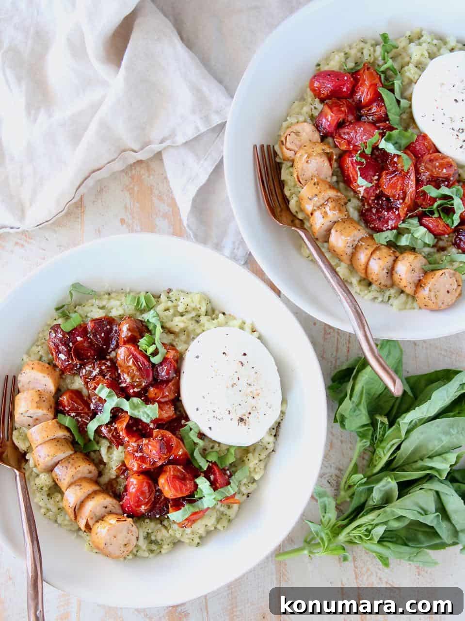 Creamy Instant Pot Pesto Risotto 3 Pesto risotto in bowl topped with roasted cherry tomatoes, sliced sausage and a ball of burrata cheese