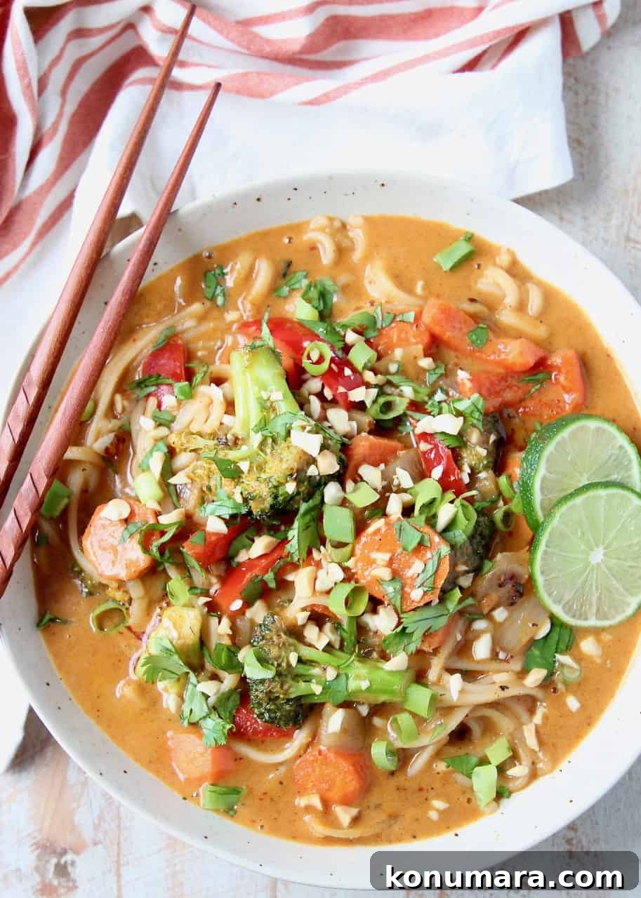 Overhead images of massaman curry sauce with vegetables and noodles in bowl, with chopsticks on the side