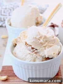 Creamy No Churn Peanut Butter Ice Cream Recipe 6 Scoops of peanut butter ice cream in white bowls with gold spoons