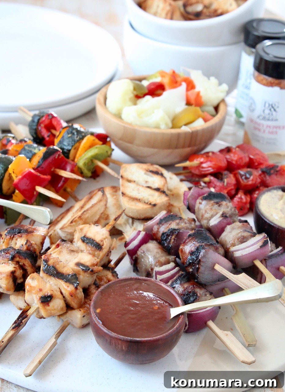 Grilled Charcuterie Board with Mini Skewers for Parties 2 Grilled mini skewers on charcuterie board with bowls of sauces