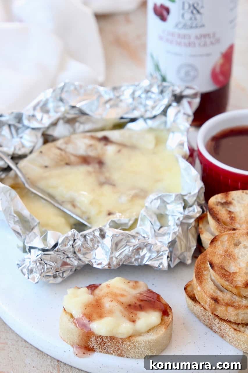 Grilled Charcuterie Board with Mini Skewers for Parties 5 Melted grilled brie in piece of foil with baguette slices