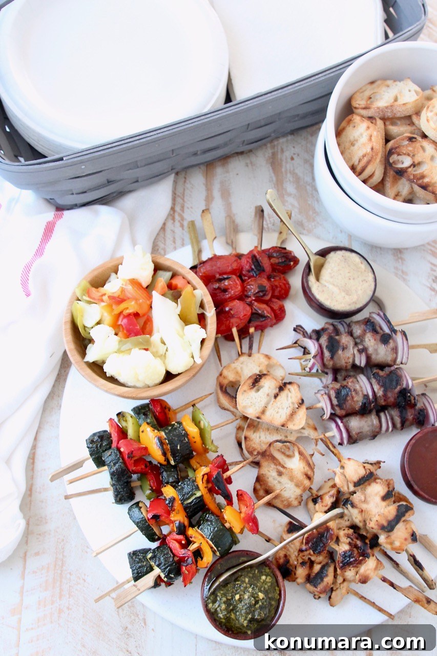 Grilled Charcuterie Board with Mini Skewers for Parties 8 Grilled mini skewers on charcuterie board next to bowl of toasted baguette slices and basket of napkins