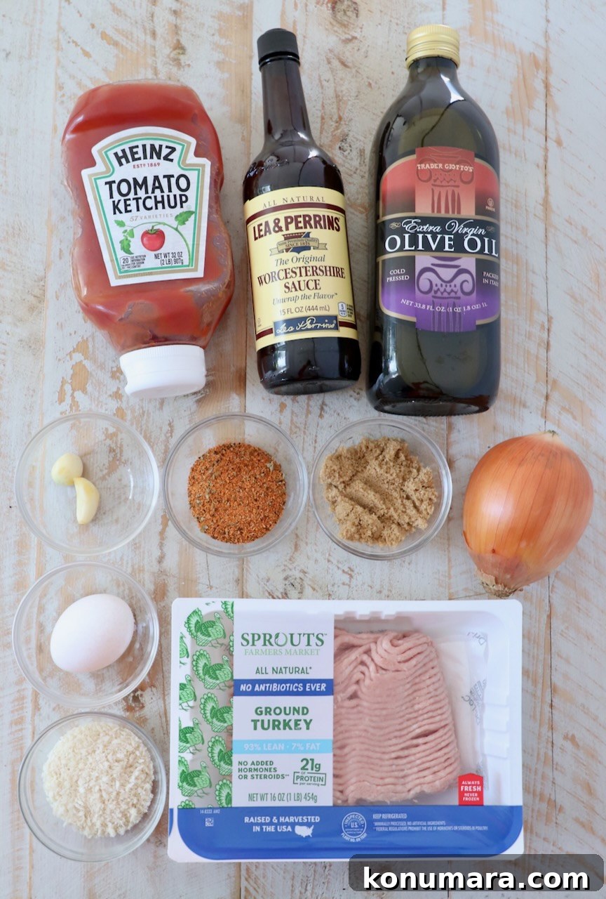 Maple-Glazed Mini Meatloaves Recipe 3 ingredients for mini meatloaves on a white wood board