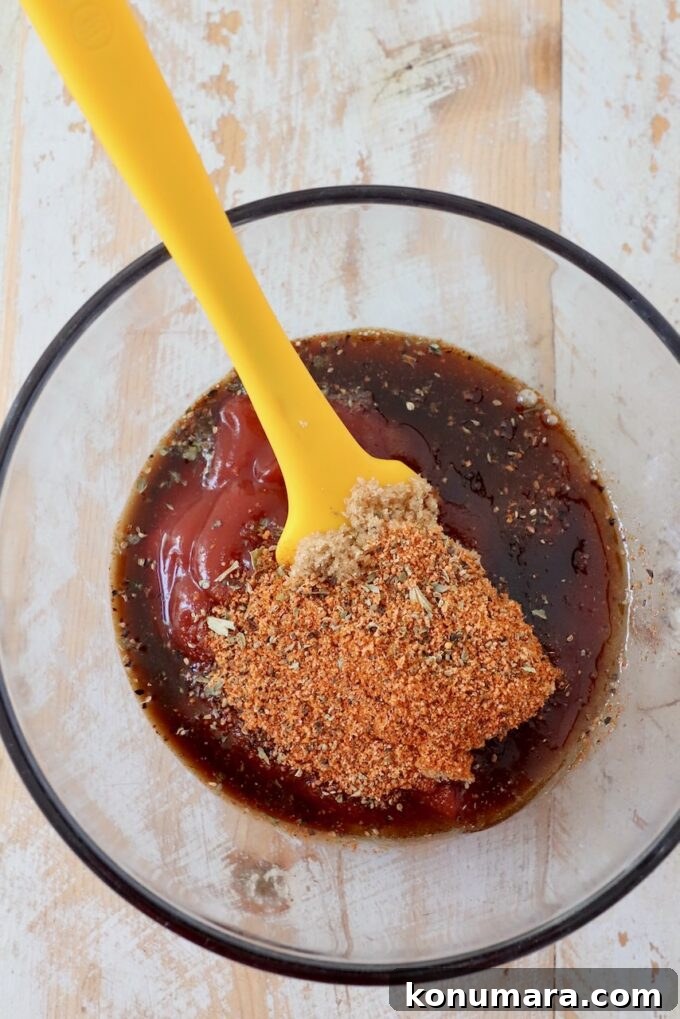 Maple-Glazed Mini Meatloaves Recipe 7 spices, ketchup and worcestershire sauce in small glass bowl