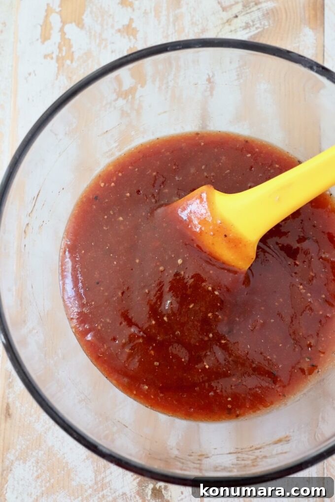 Maple-Glazed Mini Meatloaves Recipe 8 homemade bbq sauce mixed up in small glass bowl with spatula